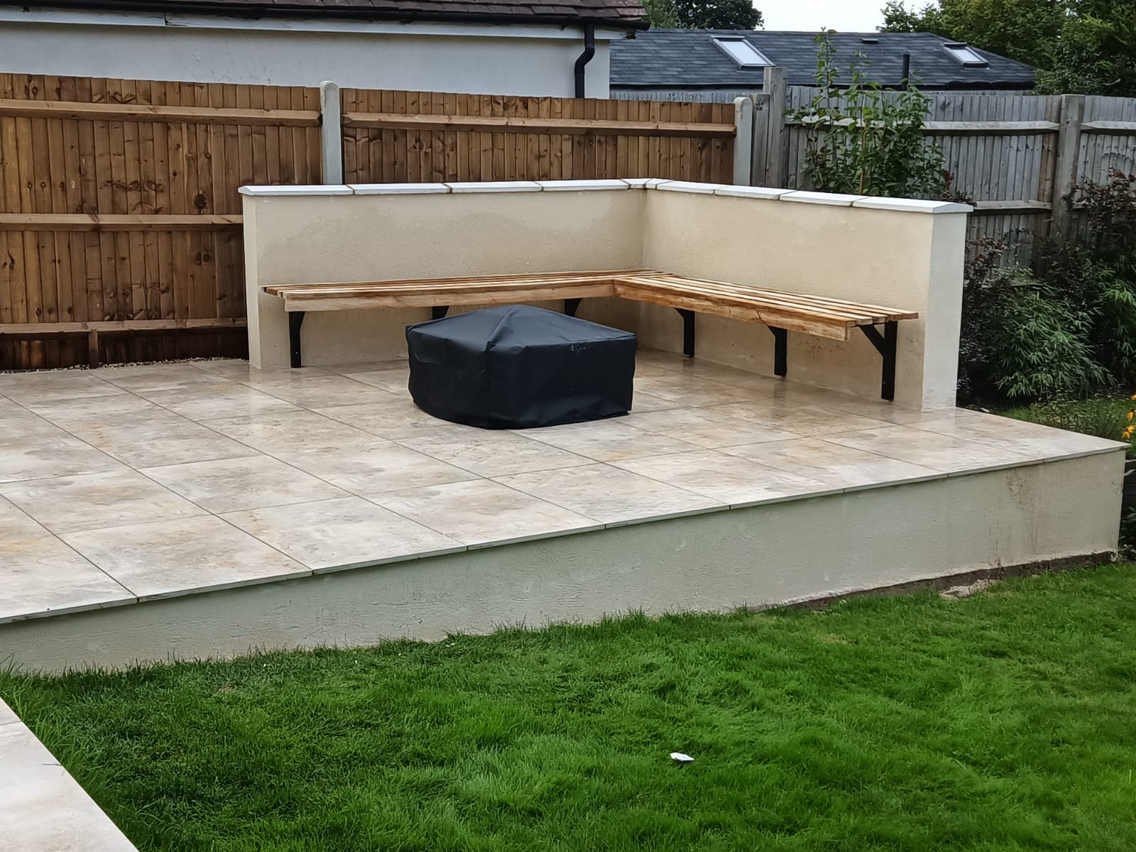Patio with bench and fire pit in Staplehurst, Kent